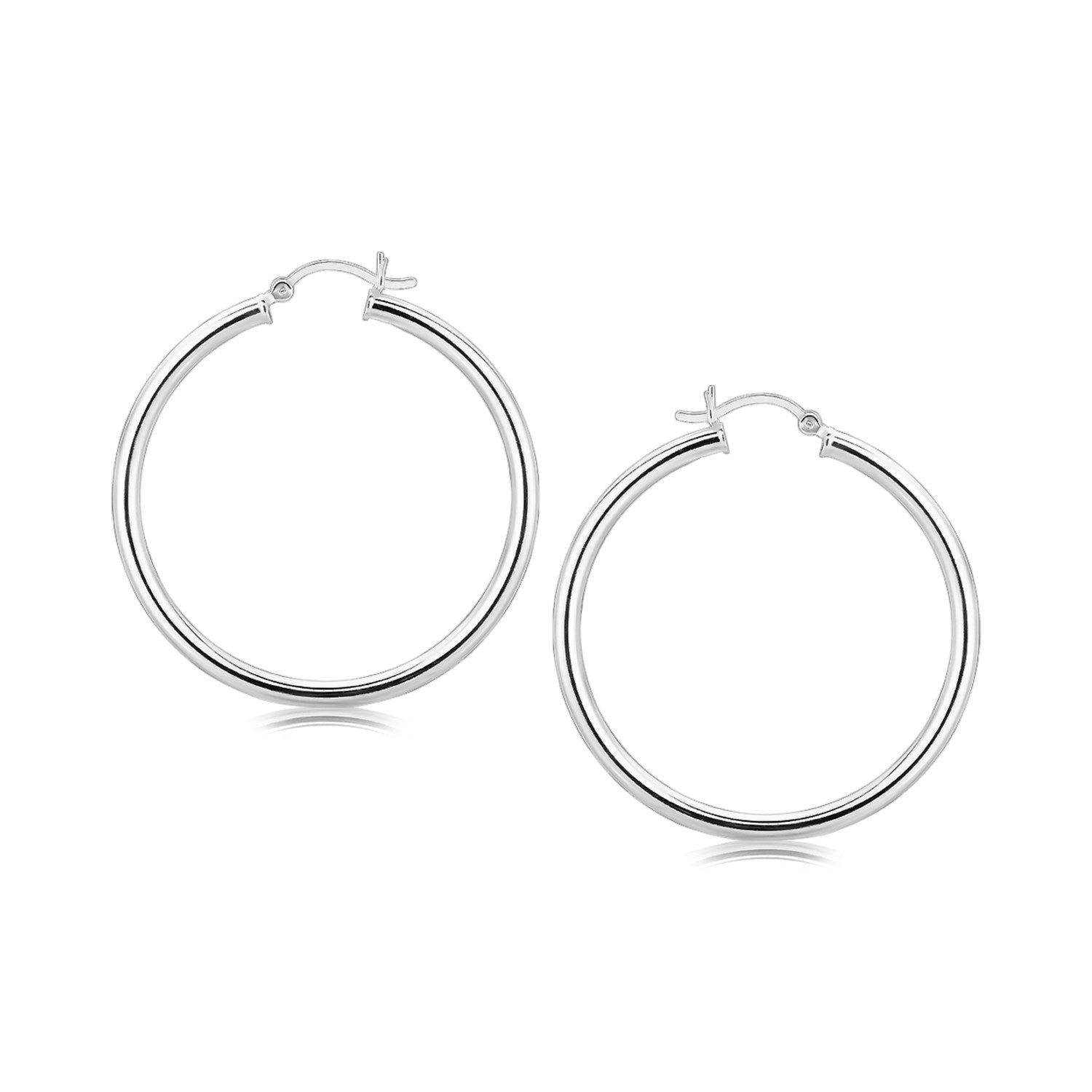 A pair of large, polished sterling silver hoop earrings with snapbacks.