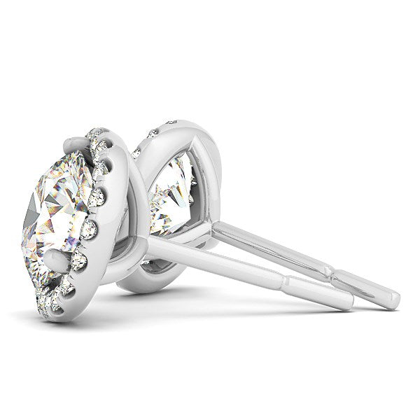 A pair of 14k white gold round prong halo style diamond earrings with push backs.