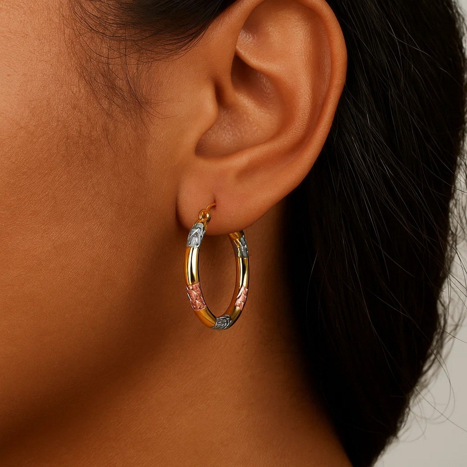 10k tri-color gold classic hoop earrings with diamond cut details.