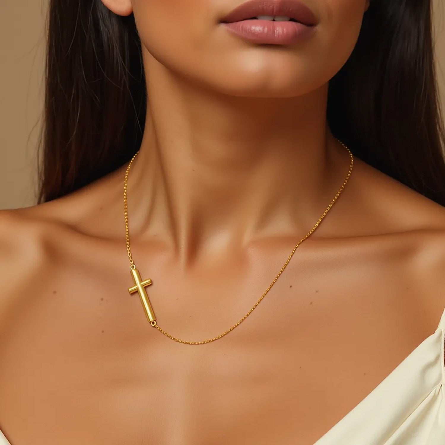 14k yellow gold necklace with a polished horizontal cross design.