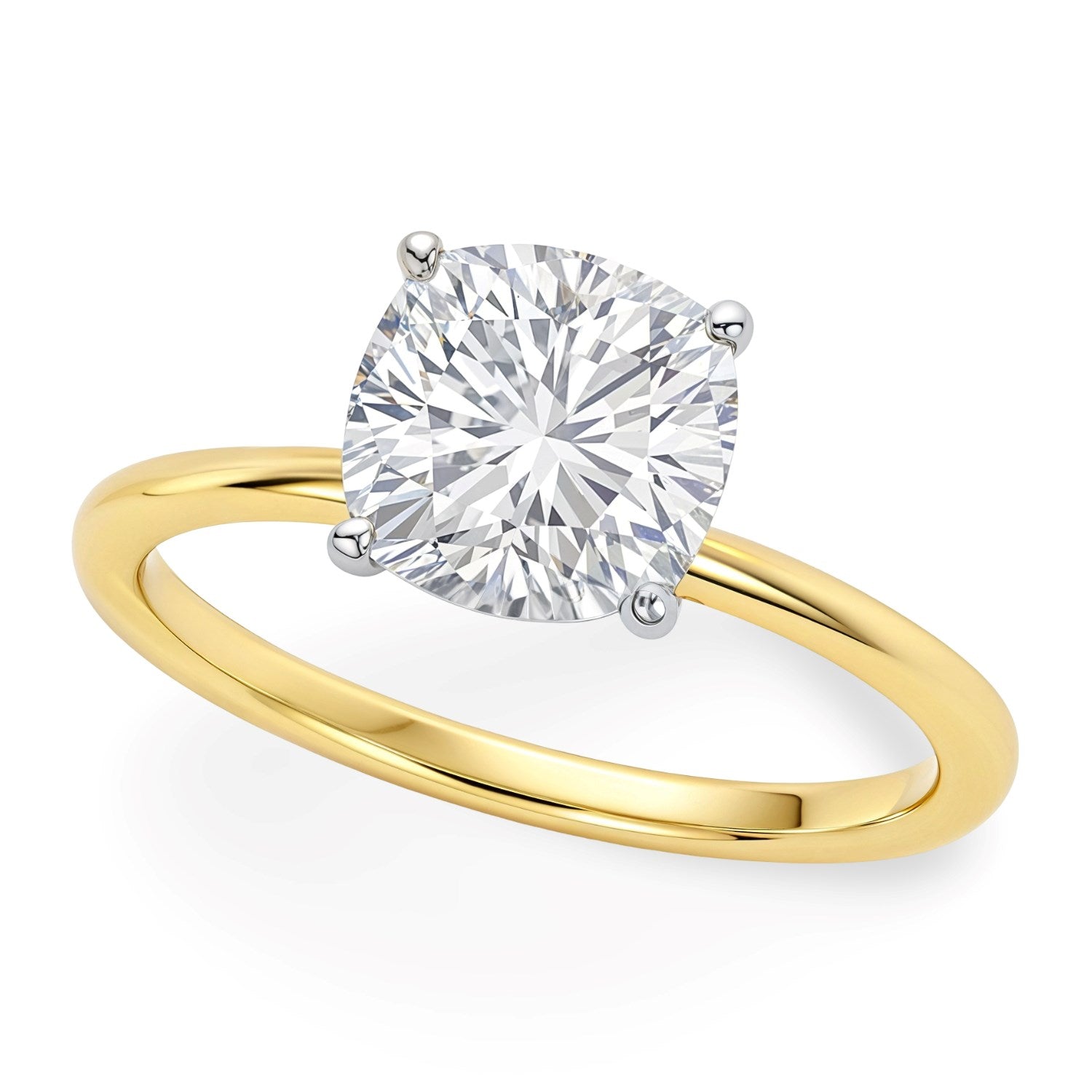 A cushion-cut lab-grown diamond solitaire ring in 10K yellow gold with white gold prongs.