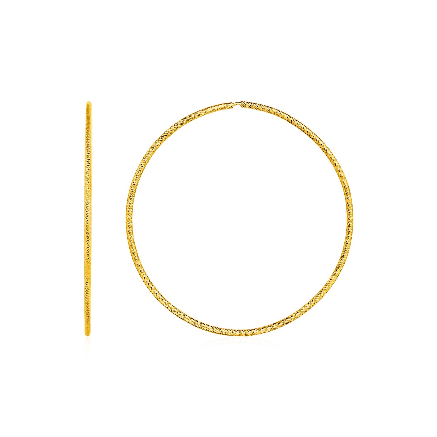A pair of textured, endless hoop earrings in 14k yellow gold.