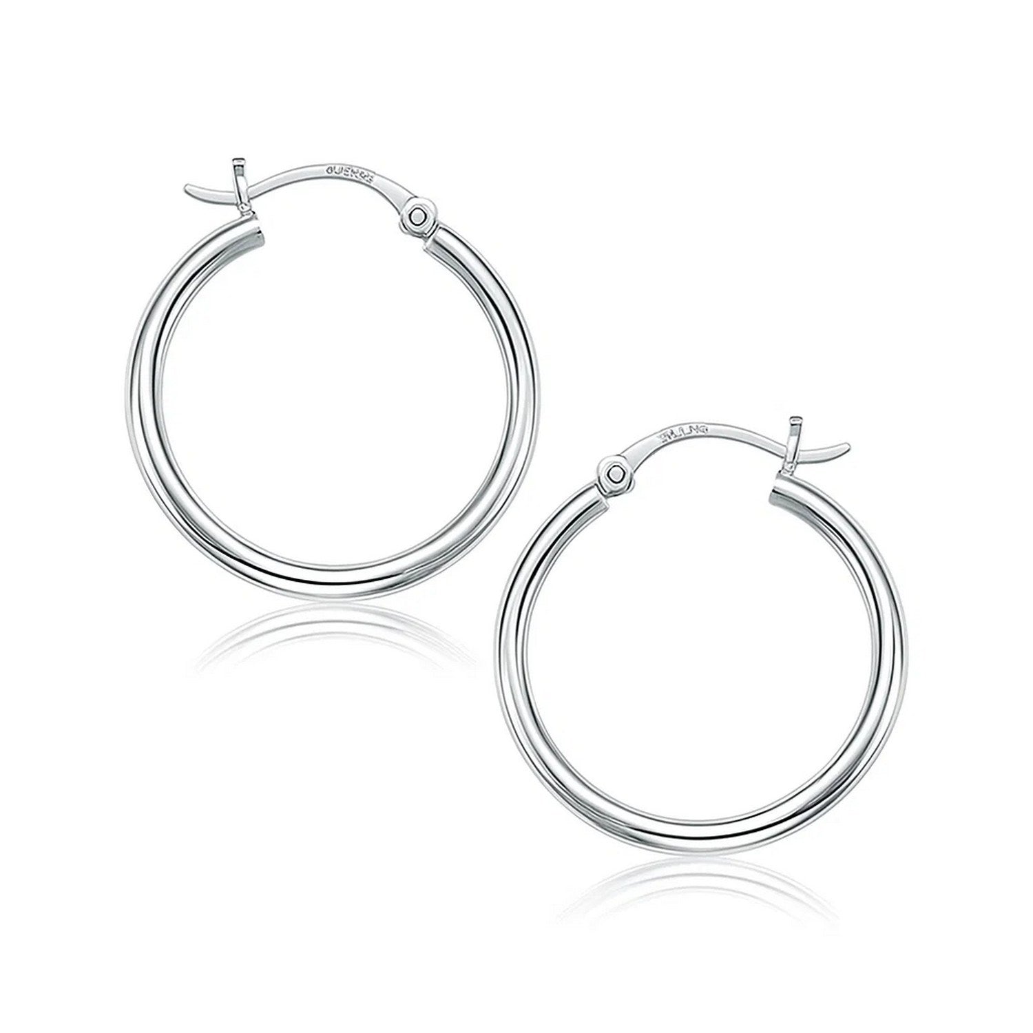 Pair of polished 10k white gold hoop earrings with snap lock backings.