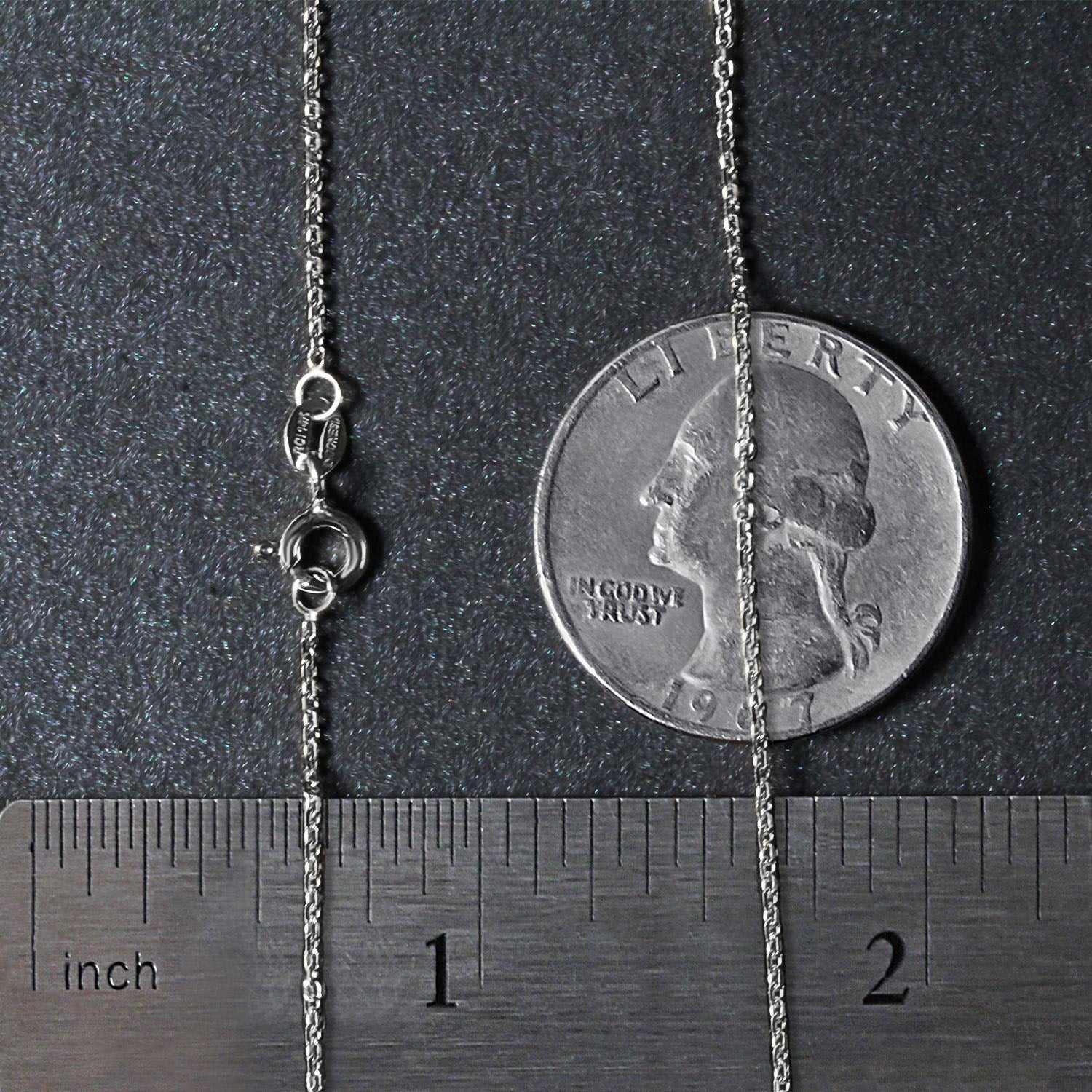 18k white gold diamond cut cable link chain with a spring ring clasp, shown with a ruler and coin.