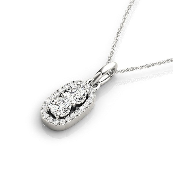 White gold oval pendant with two large diamonds surrounded by smaller diamonds on a chain.