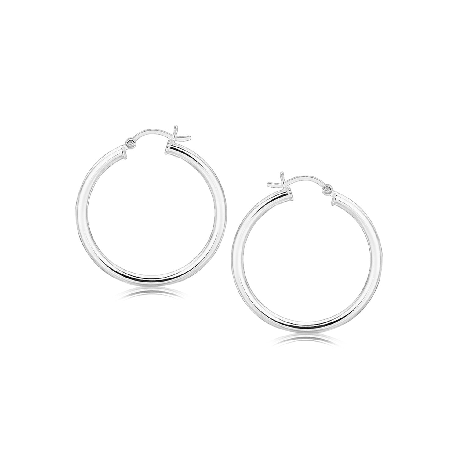 A pair of polished rhodium-plated sterling silver hoop earrings with snap locks.