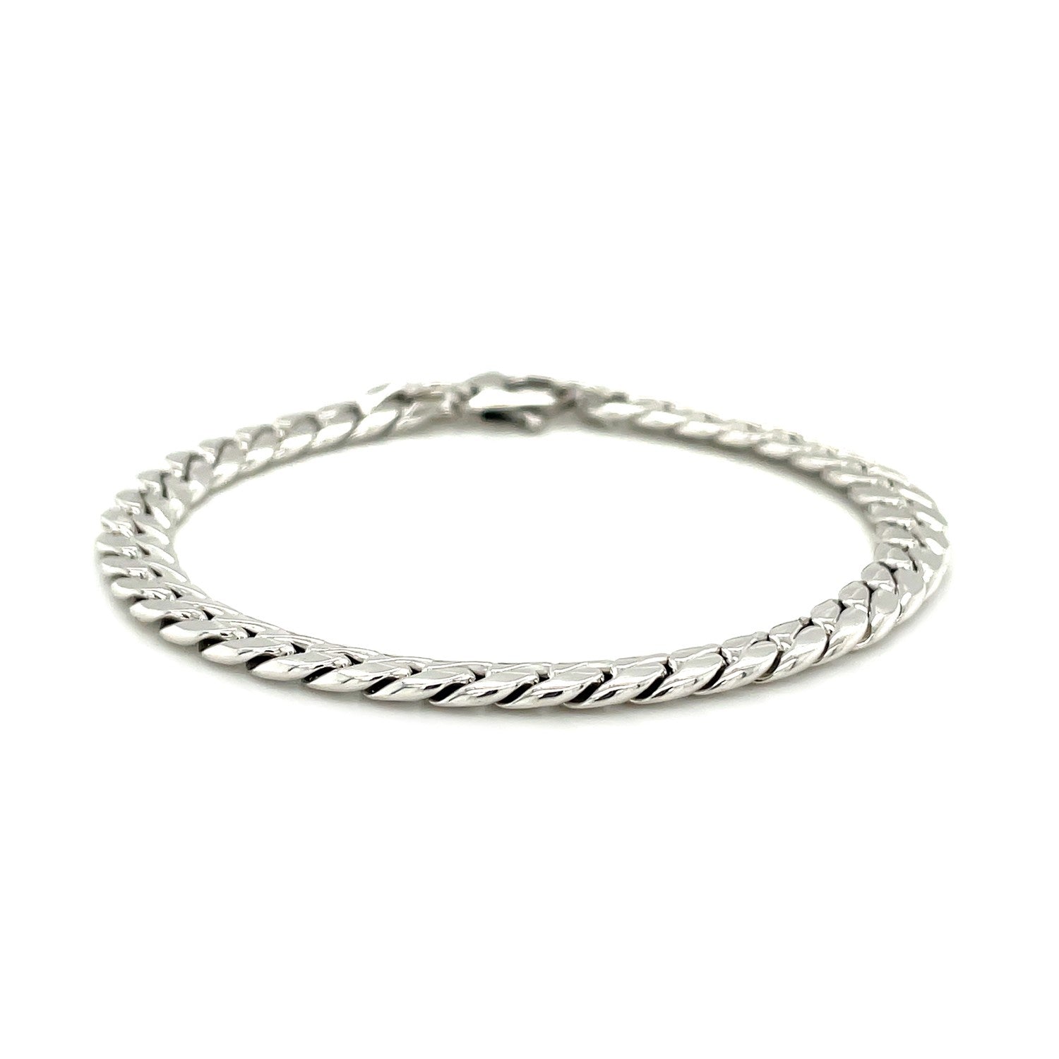 14K white gold Cuban link bracelet with a lobster clasp.