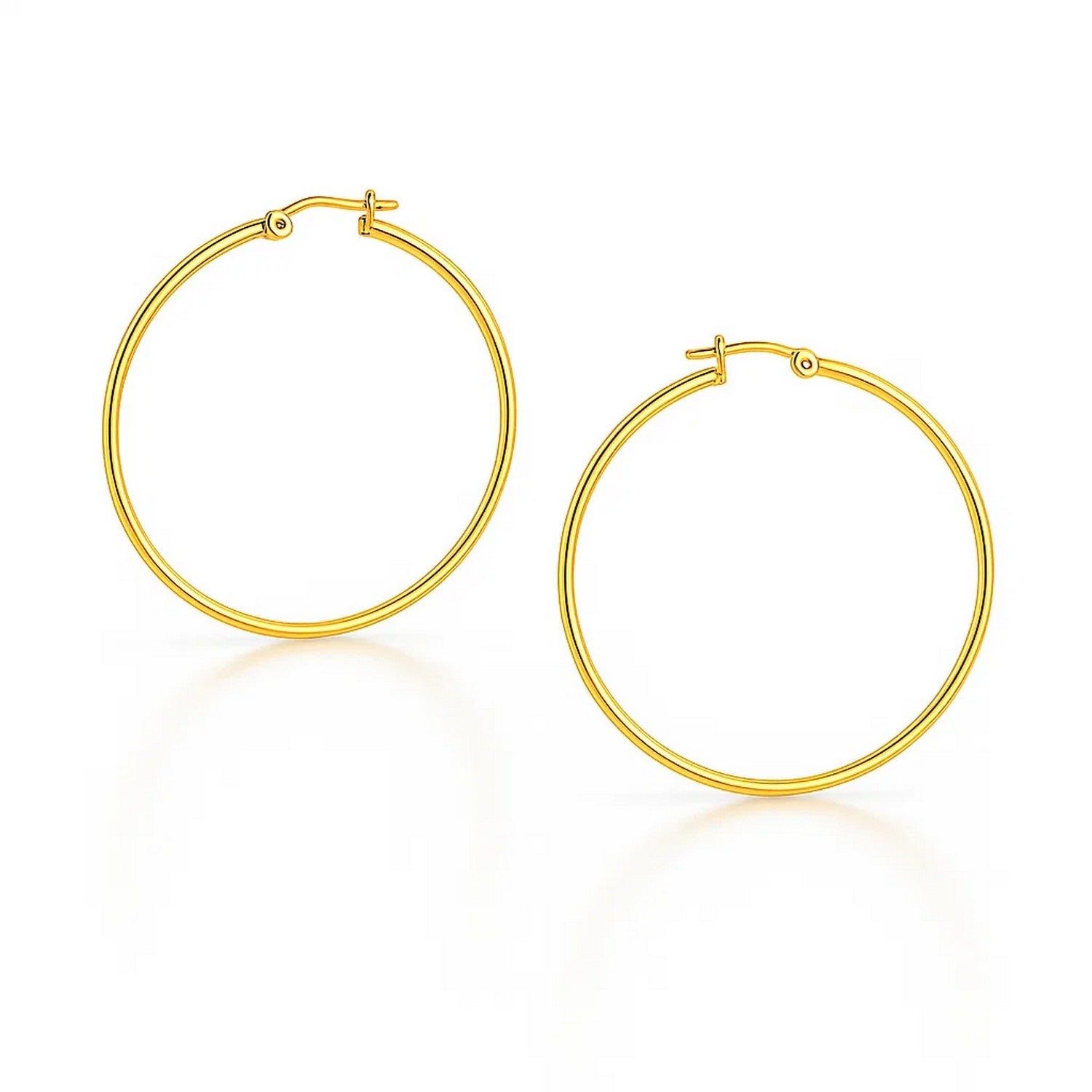 Two polished 10k yellow gold hoop earrings with snap lock backings.