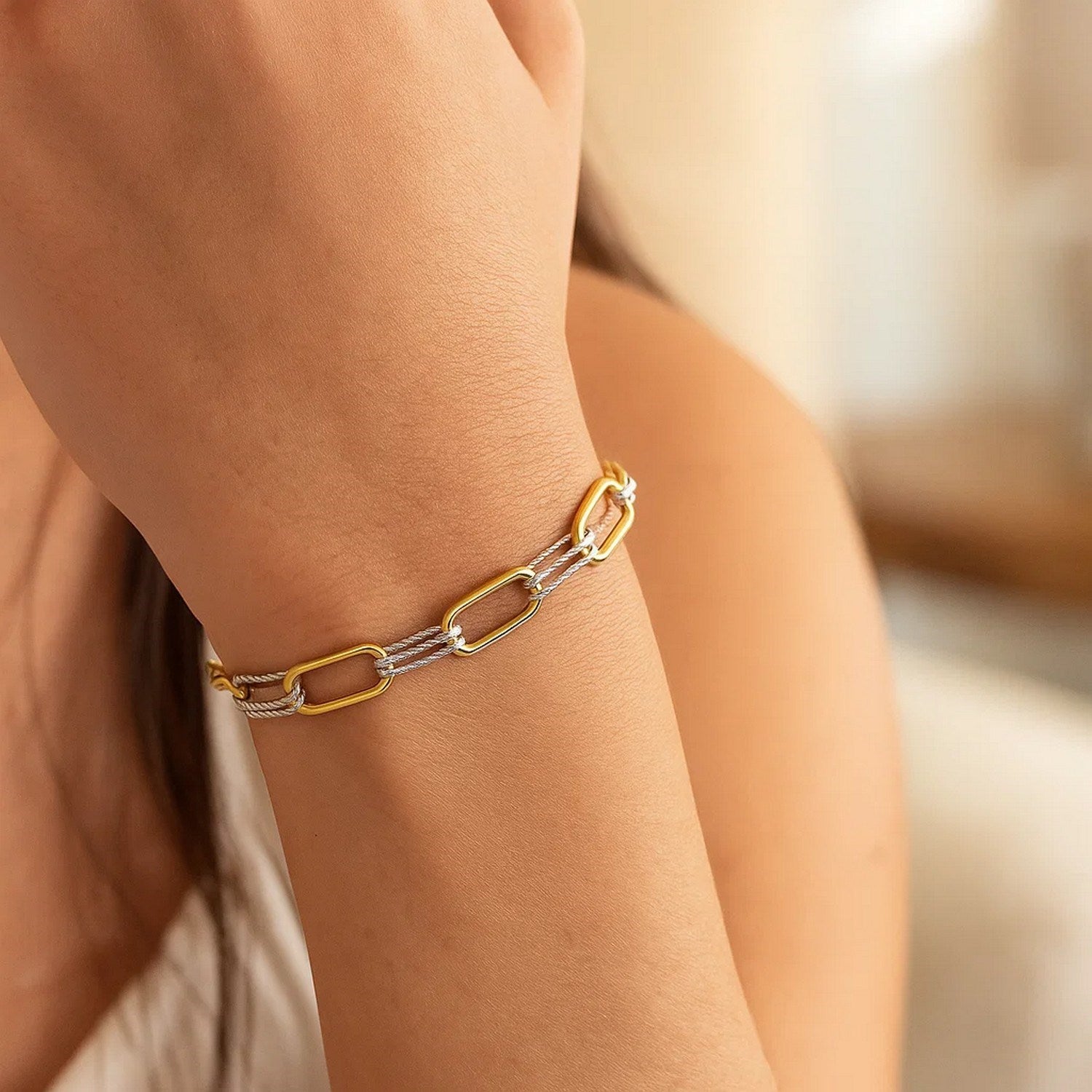 14K two-tone gold paperclip bracelet with yellow and white gold links.