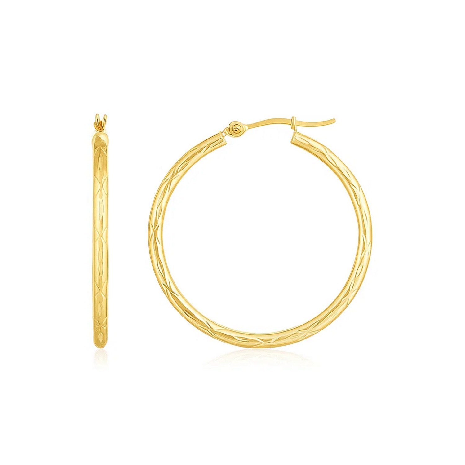 A pair of 14K yellow gold diamond-cut hoop earrings with a hinged clasp.