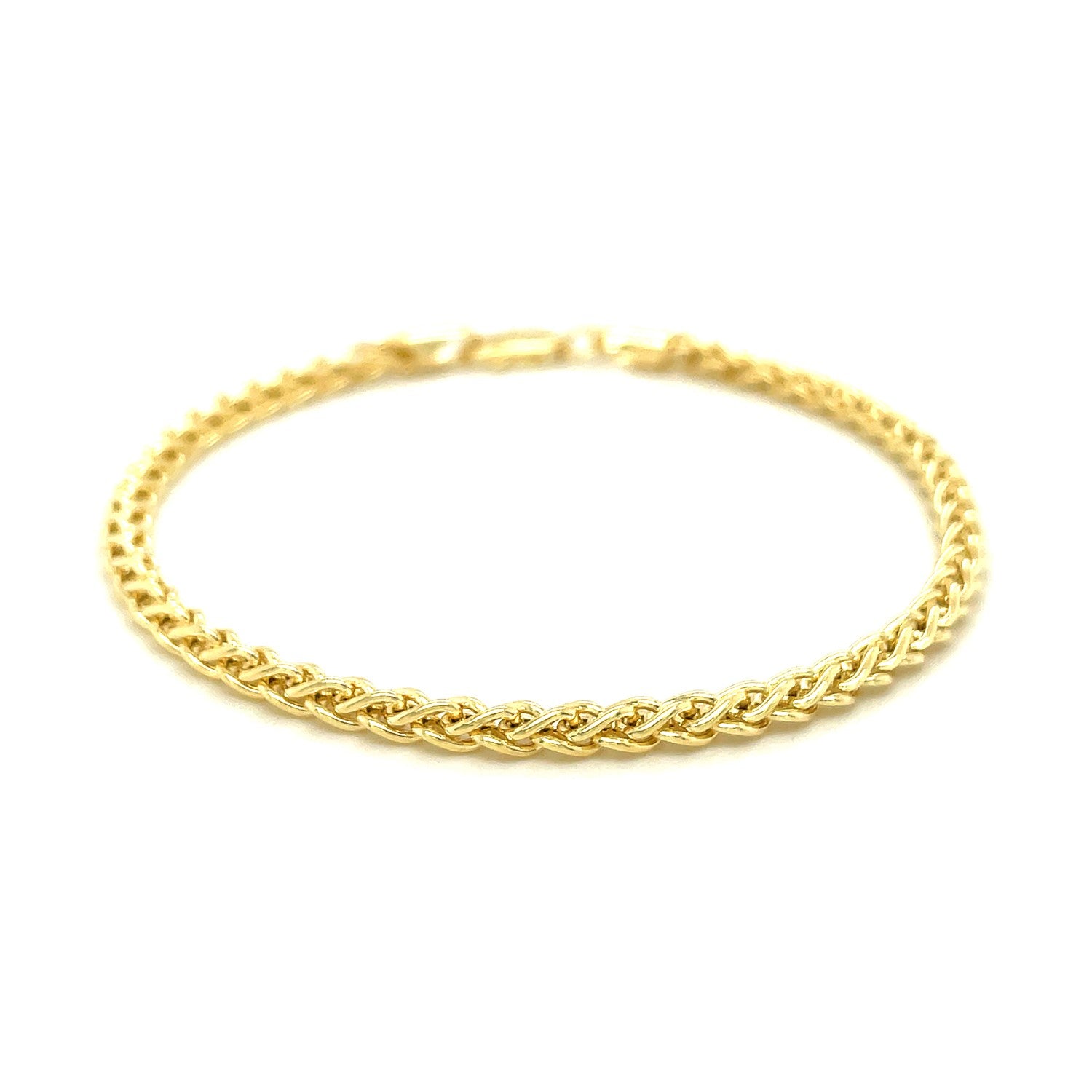 14k yellow gold light weight wheat bracelet with a lobster clasp.