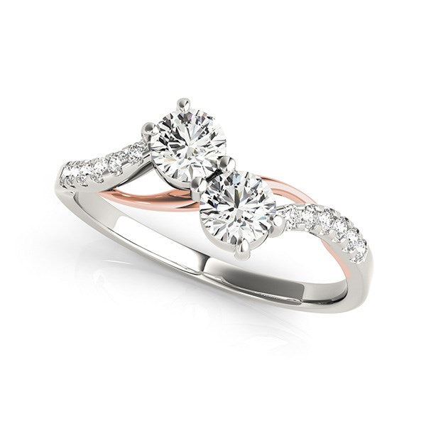 Two-stone diamond ring with a curved band in 14k white and rose gold.