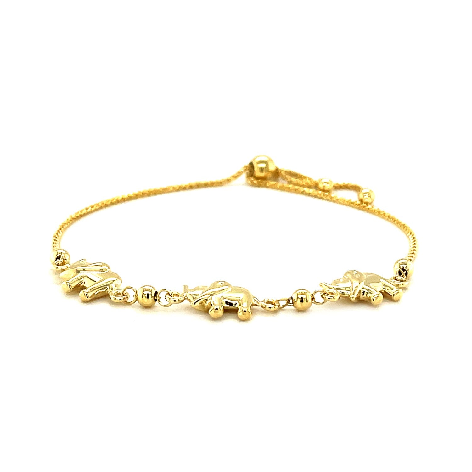 14k yellow gold lariat bracelet with three elephant stations and bead detailing.