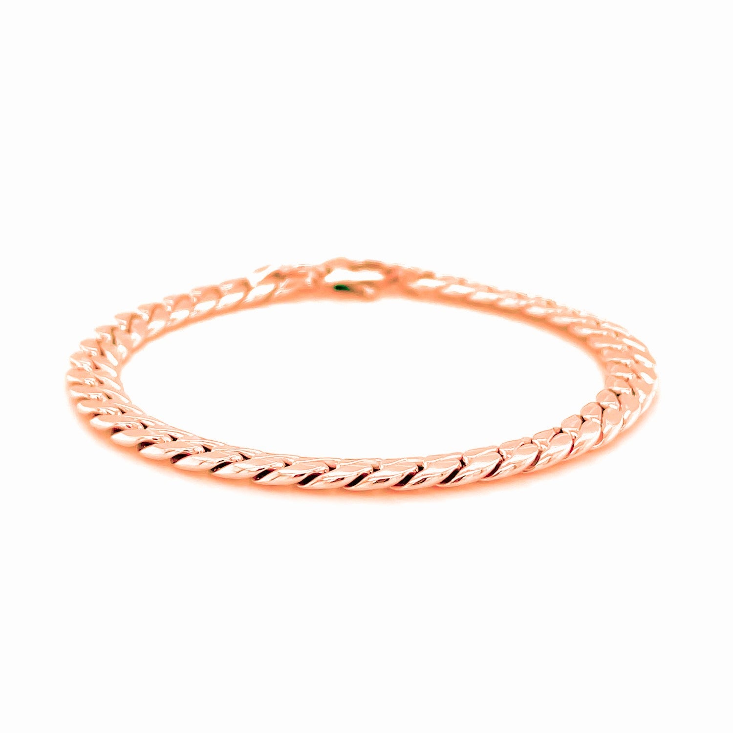 14K rose gold Cuban link bracelet with a lobster clasp.
