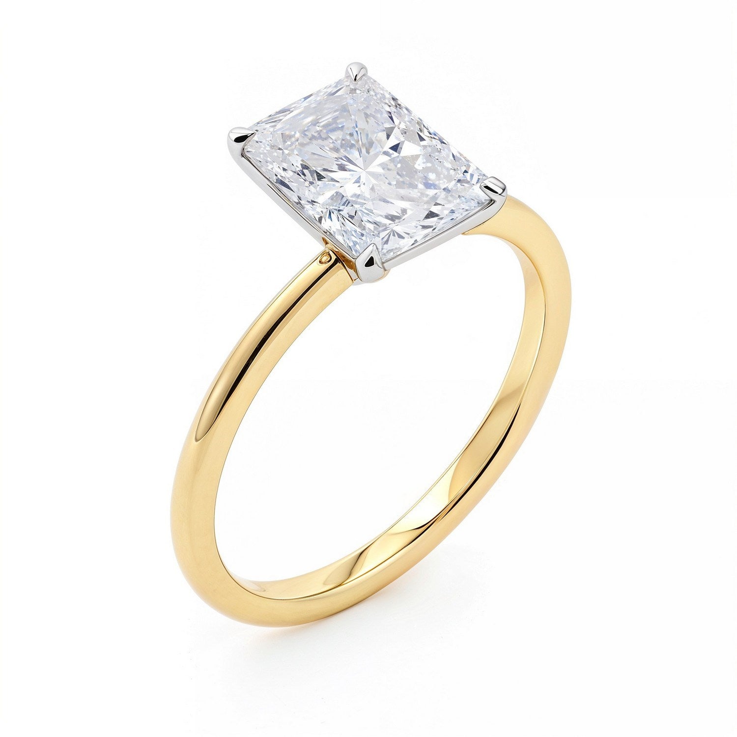 A radiant-cut lab-grown diamond solitaire ring in 14K yellow gold.