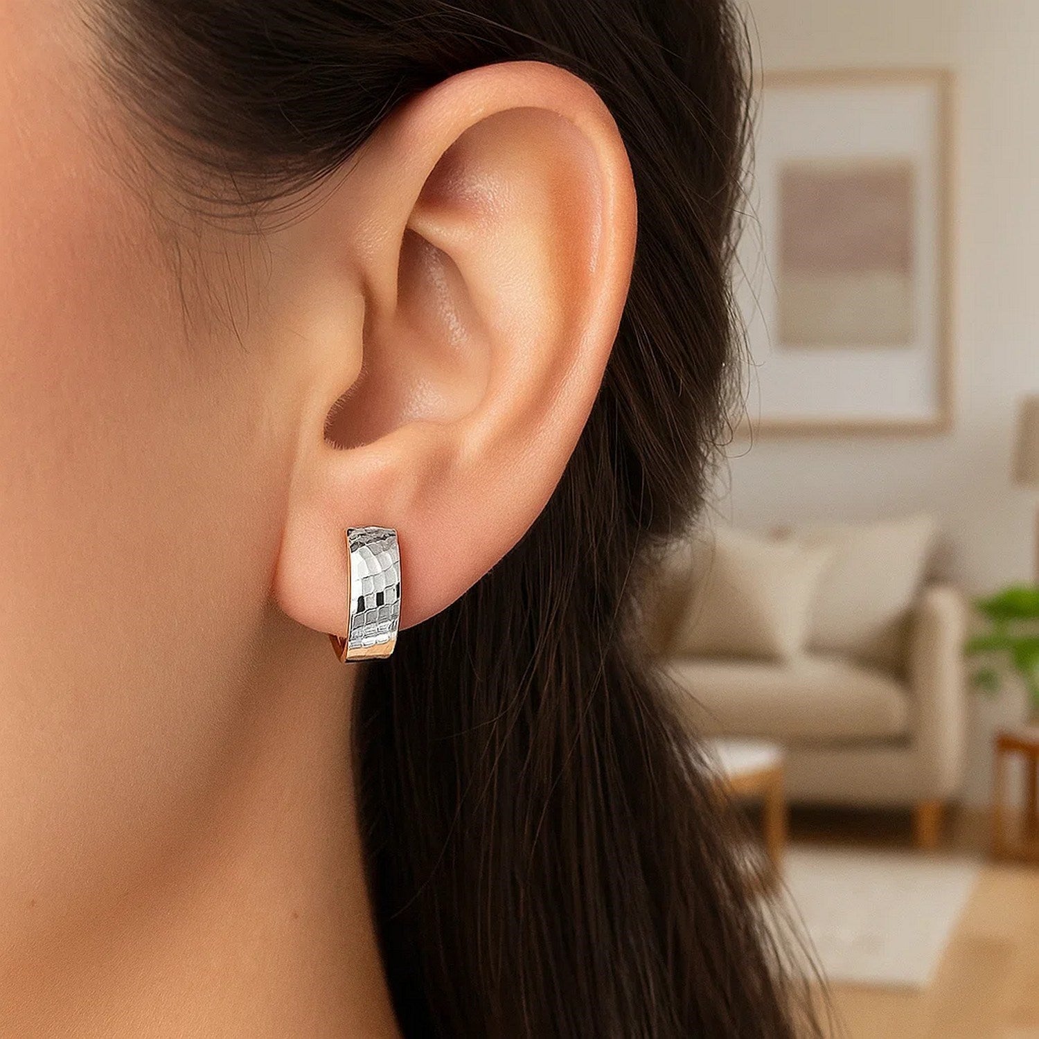 14k two-tone gold hoop earrings with polished and textured geometric sections.