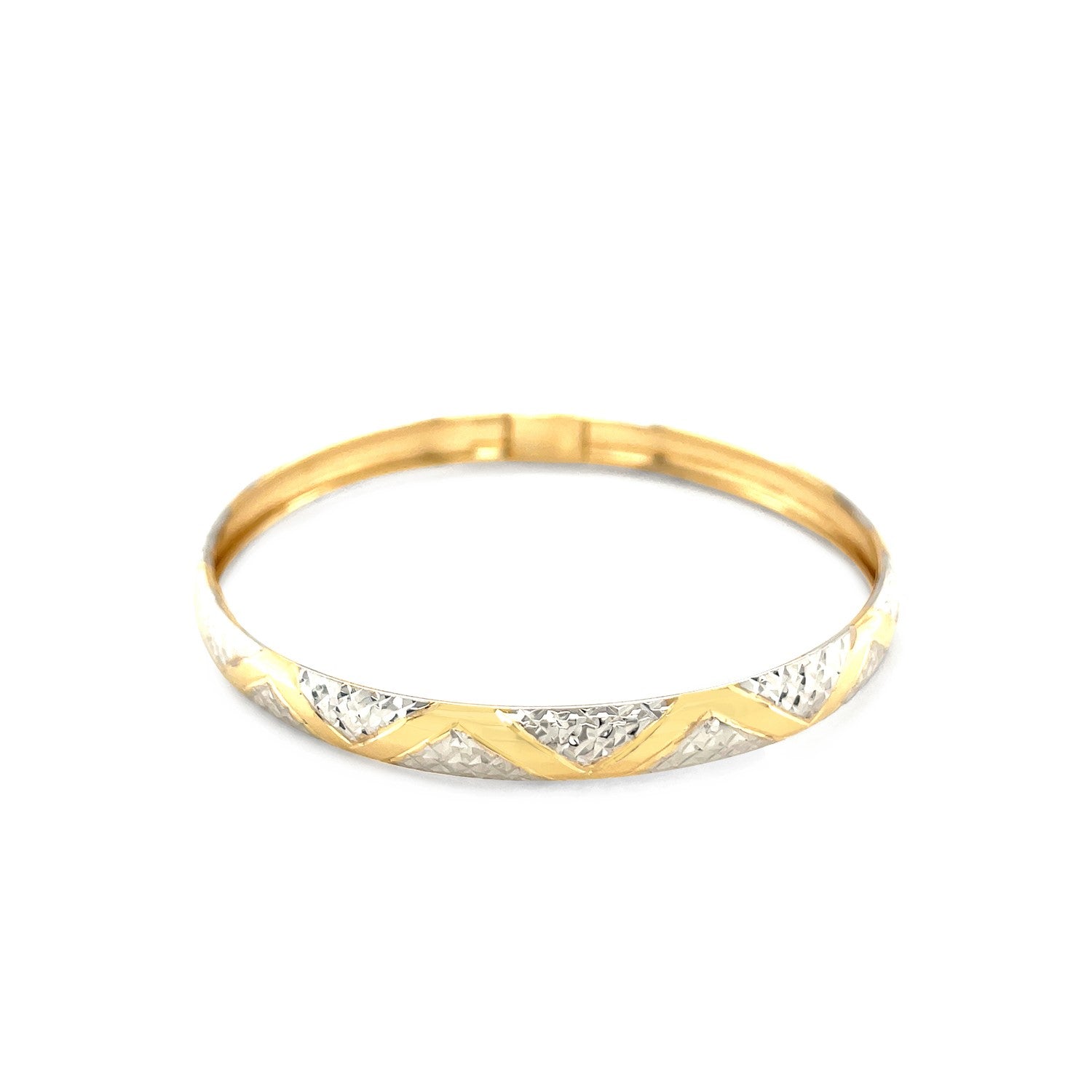 10k two-tone gold bangle with textured zigzag pattern.