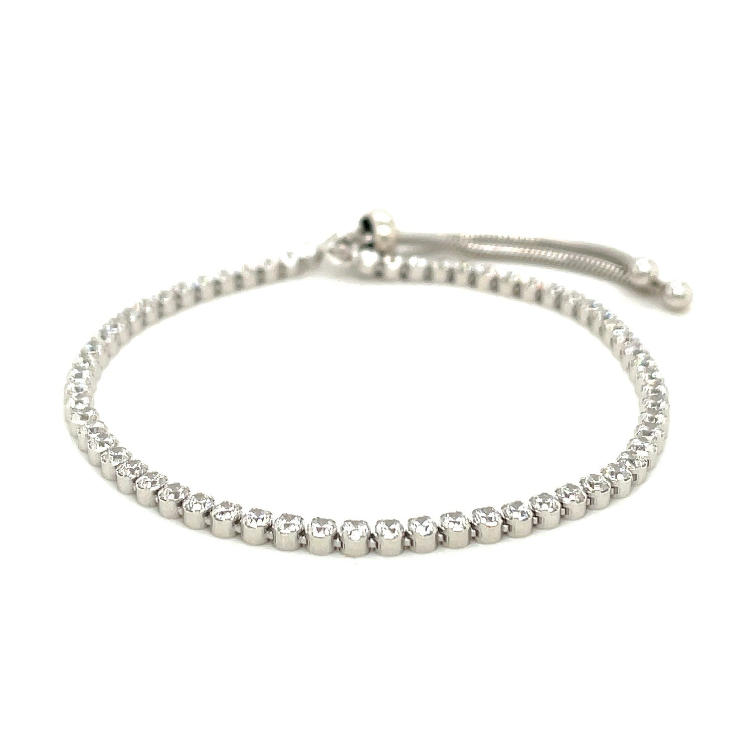 Adjustable tennis style bracelet with cubic zirconia in sterling silver.