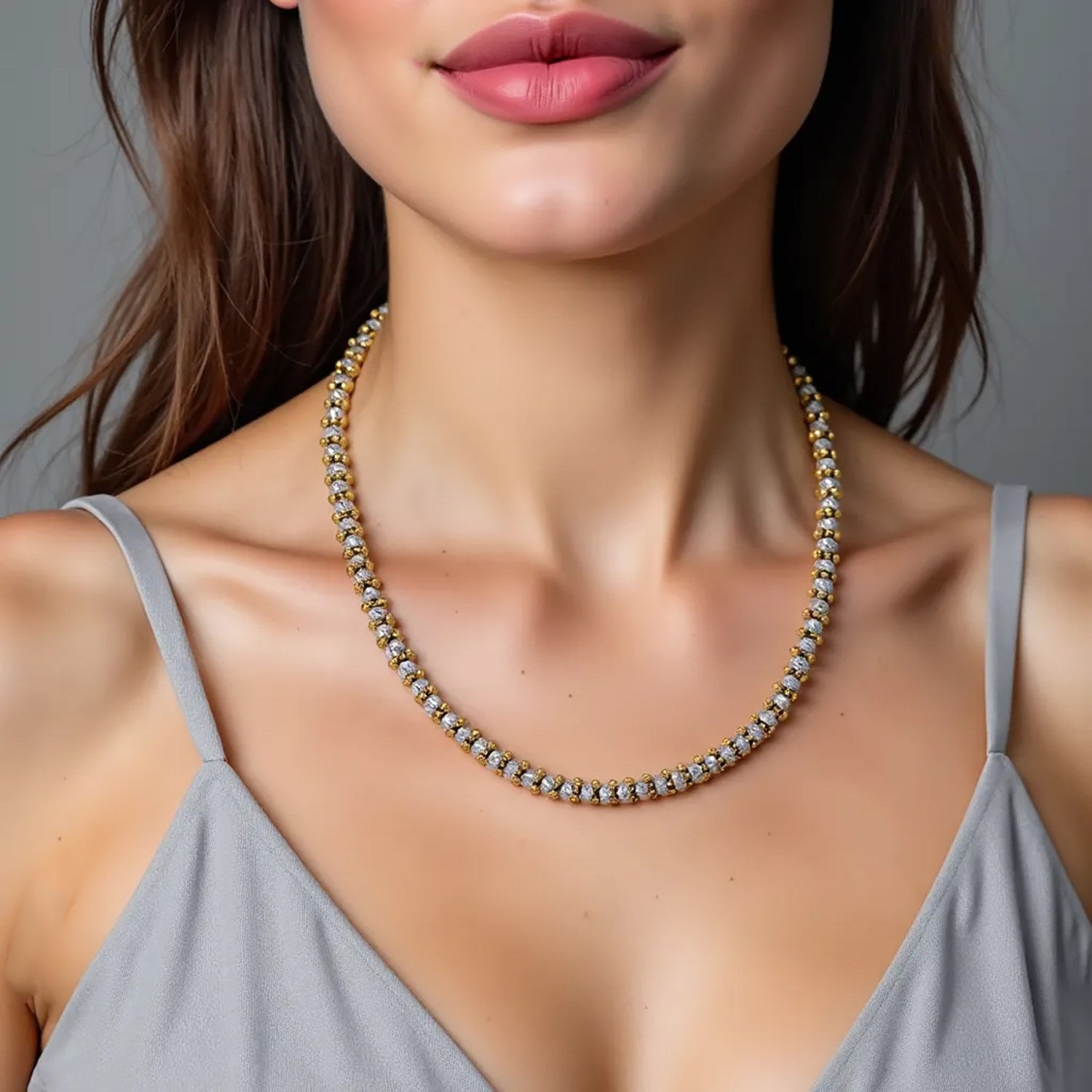 Two-tone 14K gold necklace with alternating gold spacers and textured silver beads.