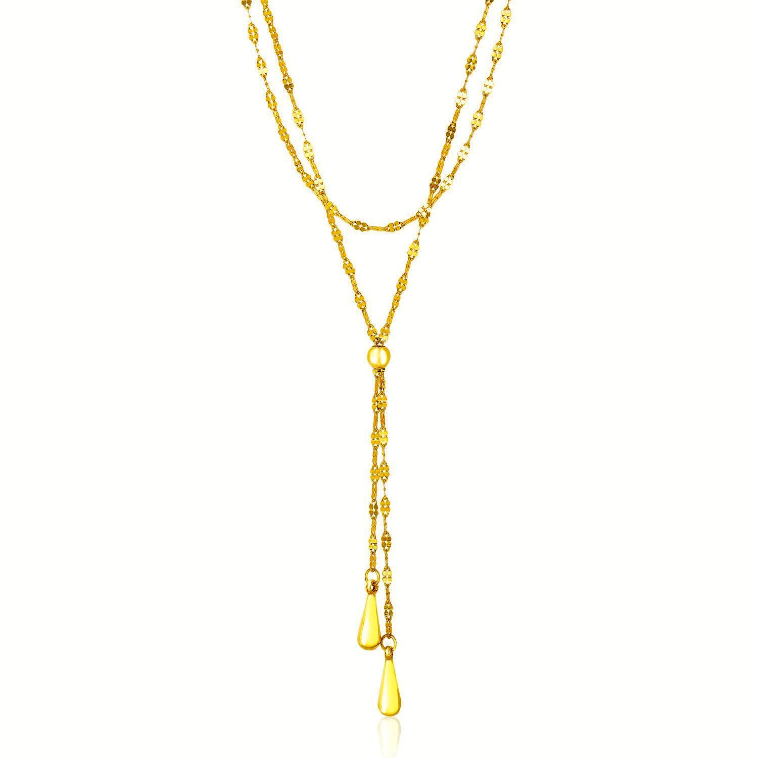 14k yellow gold double strand chain lariat necklace with puffed teardrop elements.