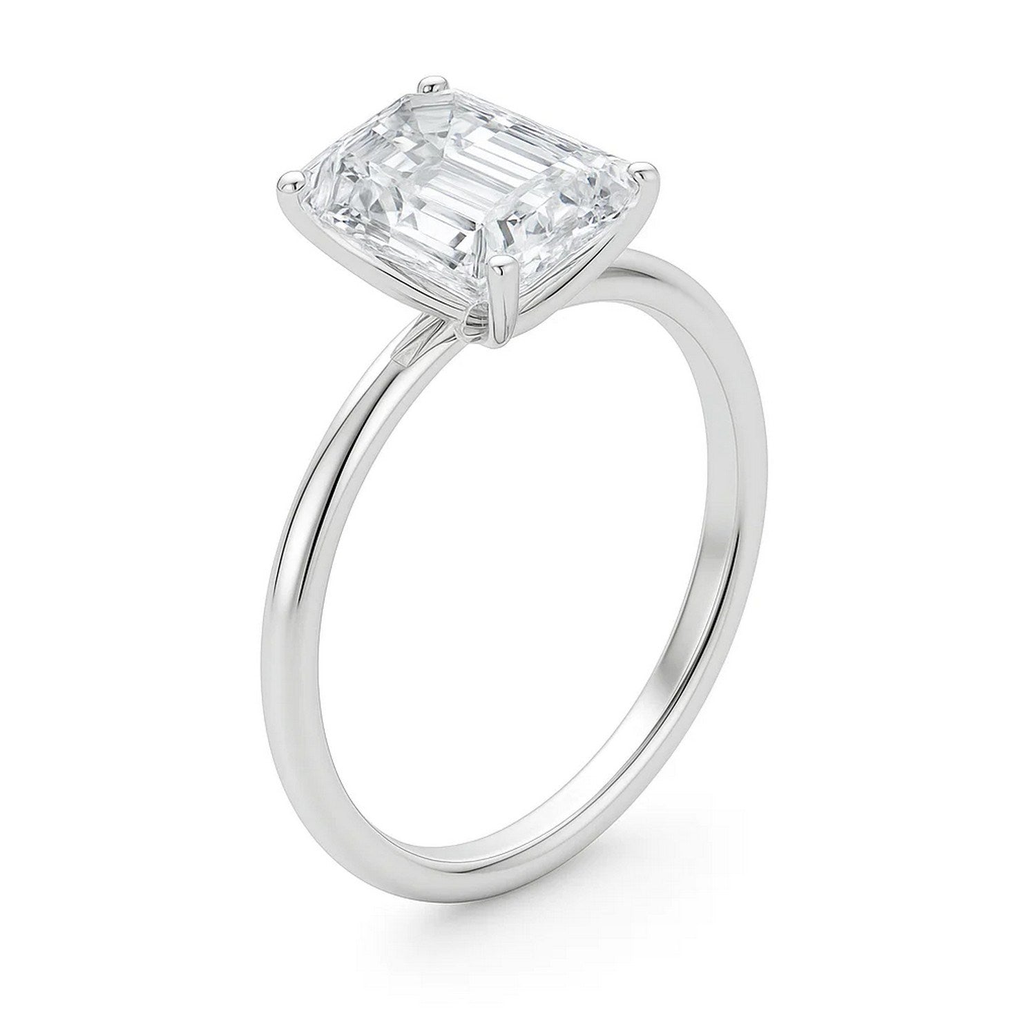 A 10K white gold solitaire ring features a large emerald-cut lab-grown diamond.