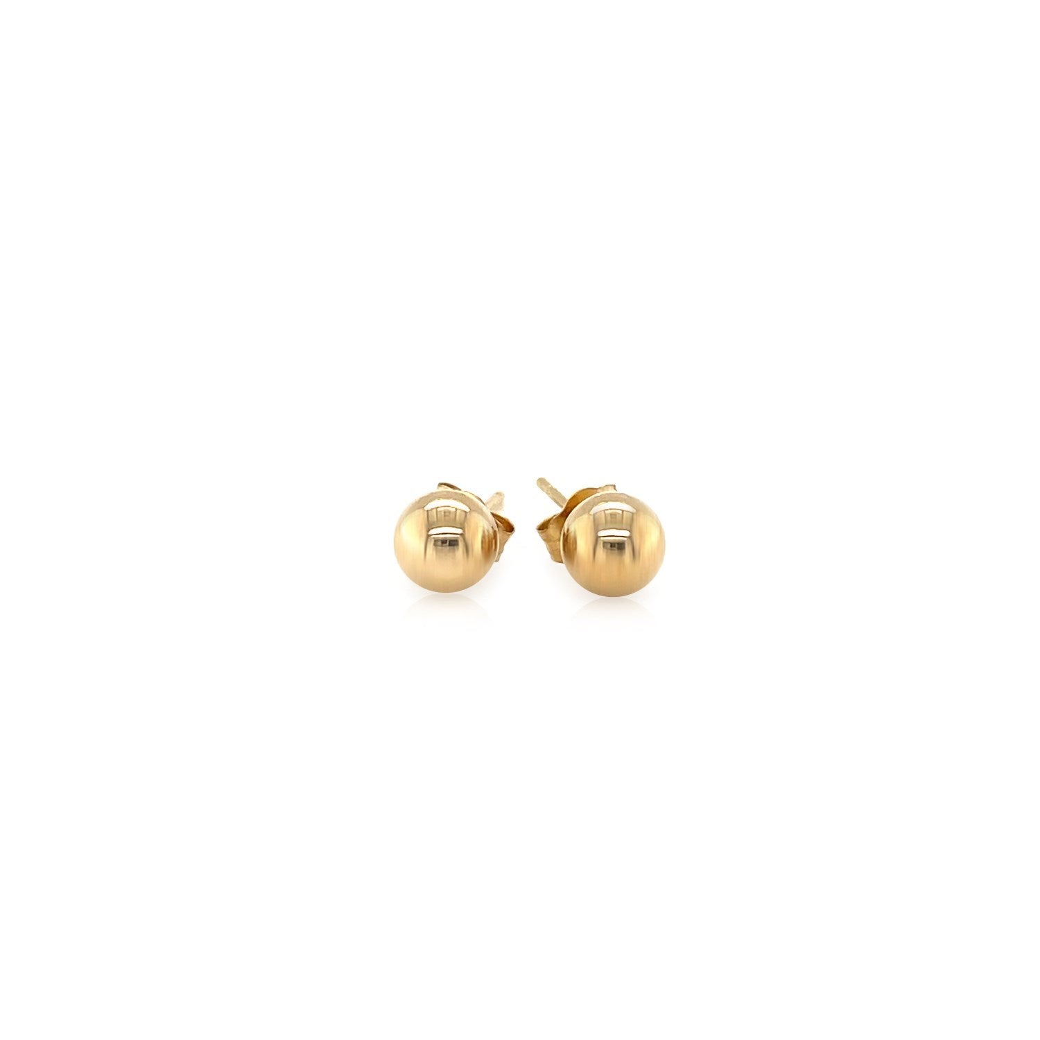 A pair of 10k yellow gold round stud earrings with push backs.