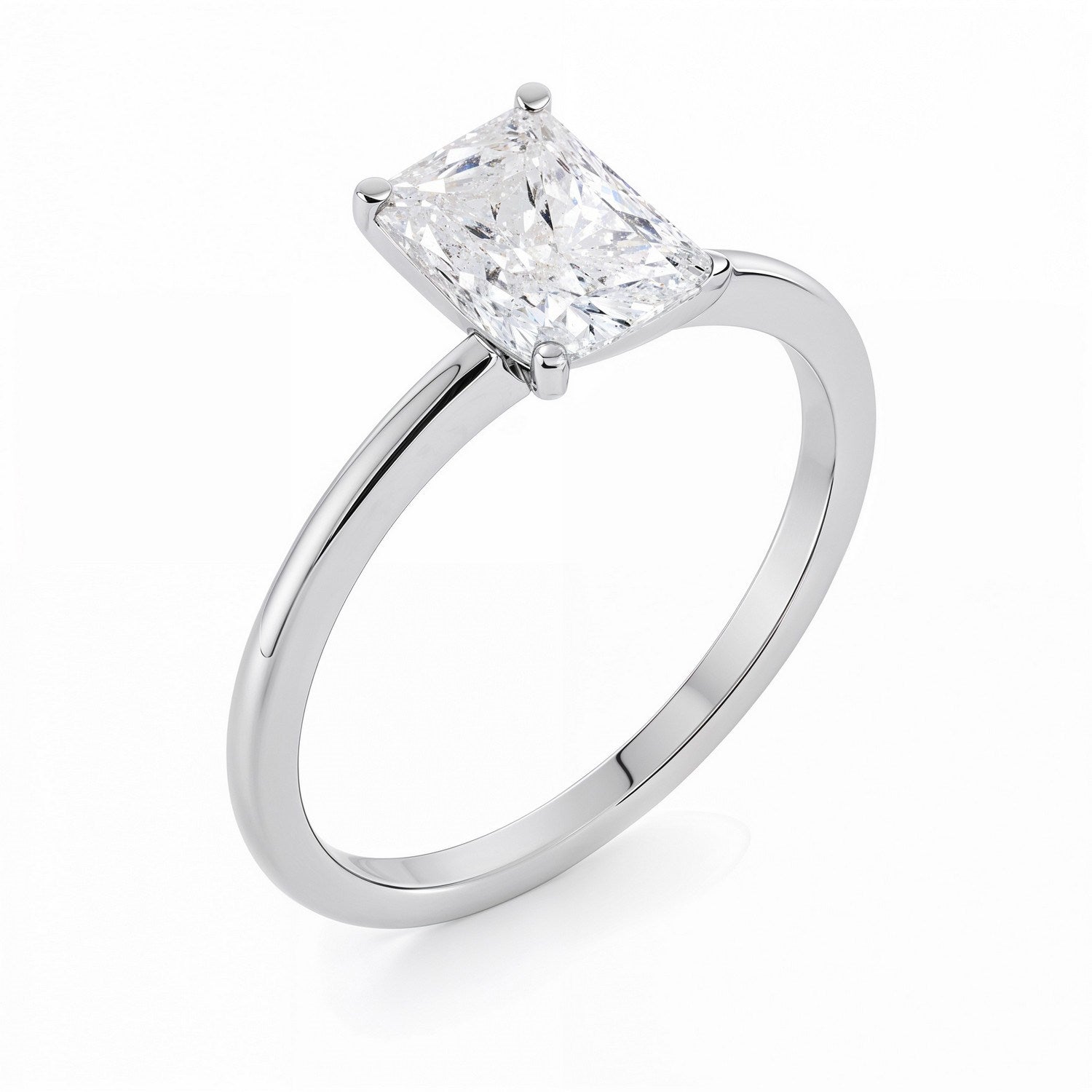 A 10K white gold solitaire ring with a radiant lab-grown diamond.