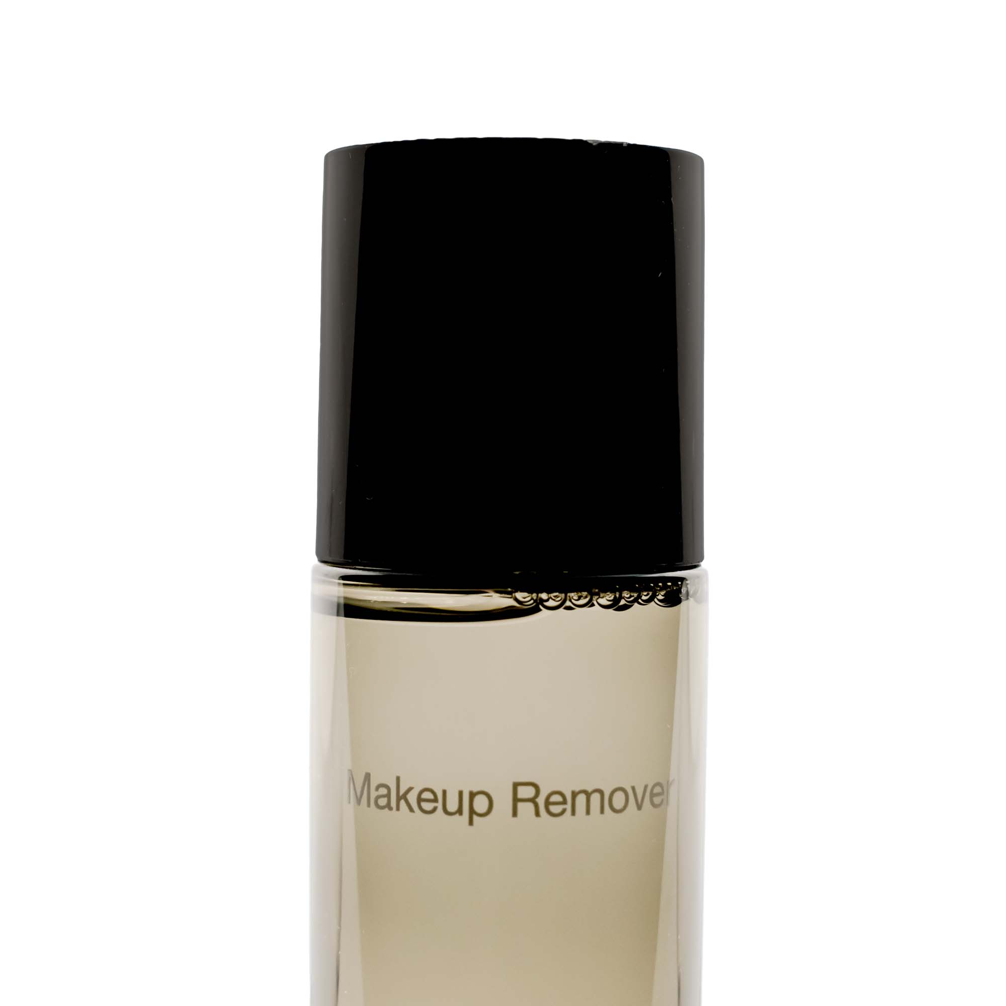 A bottle of Lip and Eye Makeup Remover with a black cap and clear liquid.