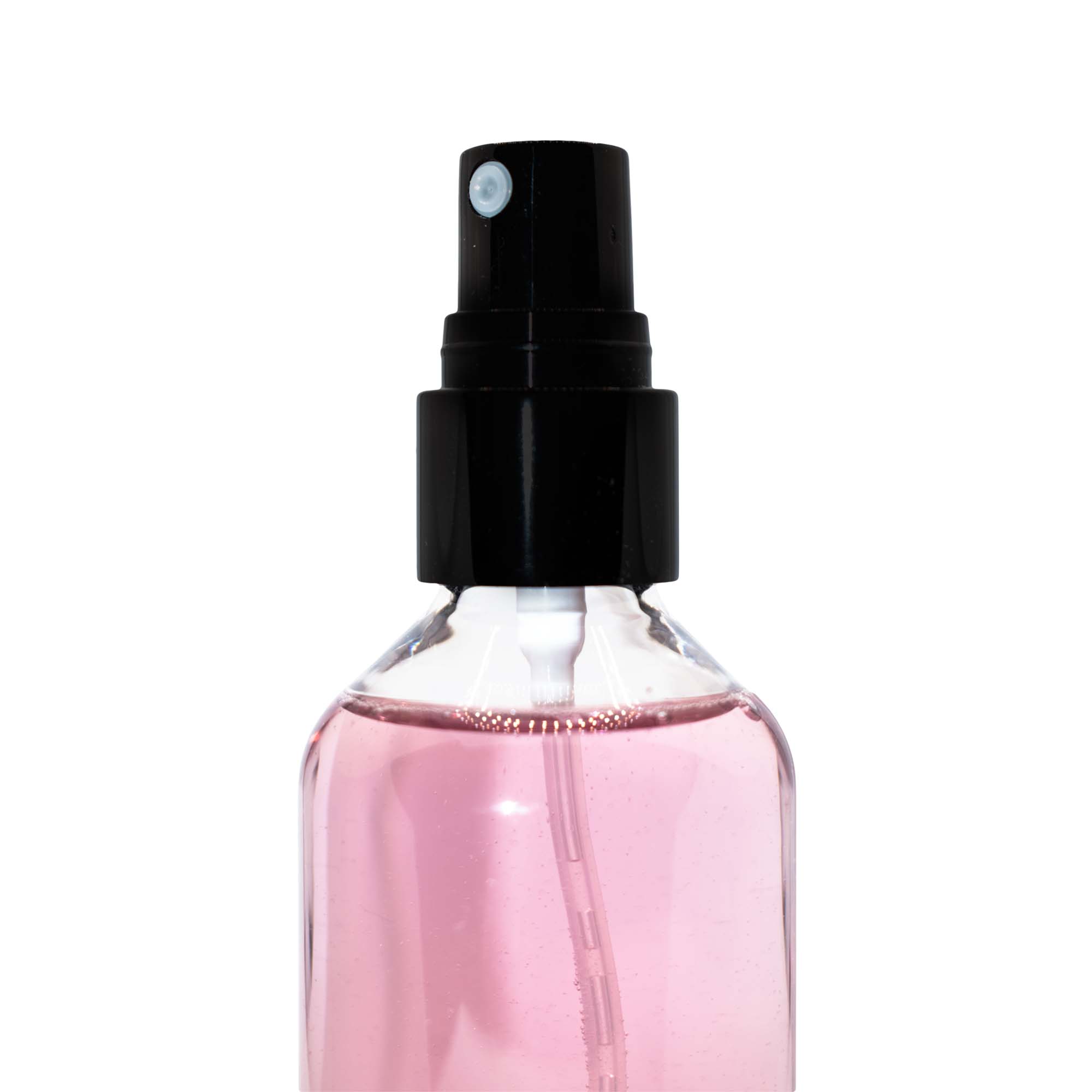 A clear bottle of pink setting spray with a black cap and white nozzle.